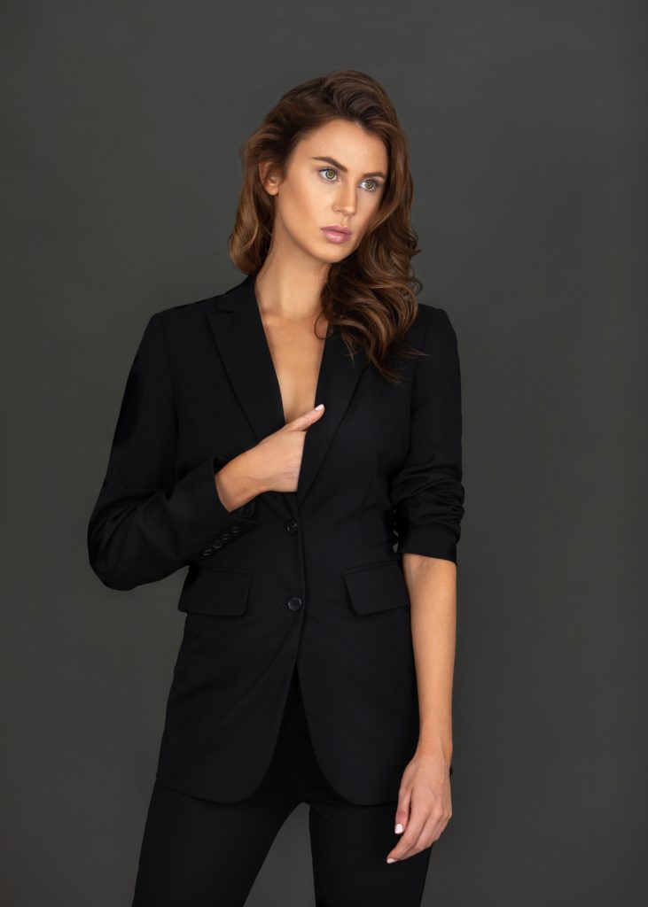 Latin Woman In Black Suit